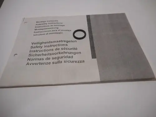 Montageanleitung von Remeha mit Sicherheitsinstruktionen in verschiedenen Sprachen, ergänzt durch einen schwarzen O-Ring auf dem Deckblatt.